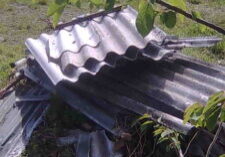 Super six ACM roofing dumped in a field
